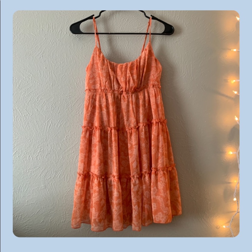 a floral print orange flowy mini dress